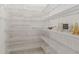 Well-organized walk-in pantry featuring numerous metal shelves for ample storage at 3175 Lake Seminole Pl, Buford, GA 30519