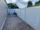 A backyard with a white fence is perfect for privacy with stone ground at 407 Aerif Place Pl, Woodstock, GA 30188