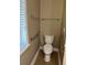 This bathroom features a toilet with accessibility features and accessories at 407 Aerif Place Pl, Woodstock, GA 30188