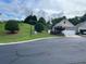 Traditional style single-Gathering home with a well-maintained lawn and an attached two car garage at 407 Aerif Place Pl, Woodstock, GA 30188
