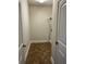 An inside view of a laundry room with a light, a shelf, and an electrical socket at 407 Aerif Place Pl, Woodstock, GA 30188