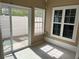 This sunroom has sliding glass doors that let in natural light to brighten the room at 407 Aerif Place Pl, Woodstock, GA 30188