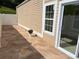 Exterior of patio features a white fence and a small potted plant next to sliding doors at 407 Aerif Place Pl, Woodstock, GA 30188