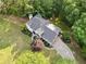 Bird's-eye view of a two-story home featuring lush landscaping, a driveway, and a meticulously maintained yard at 1801 Summerview Ct, Woodstock, GA 30189