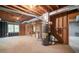 Spacious unfinished basement featuring exposed ceiling beams, and a gas water heater at 1801 Summerview Ct, Woodstock, GA 30189