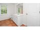 Bathroom featuring tile flooring, a vanity with storage, and a large mirror at 1801 Summerview Ct, Woodstock, GA 30189