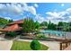 Poolside with a splash, featuring a large pool, seating, and clubhouse at 1801 Summerview Ct, Woodstock, GA 30189