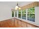 Dining room with hardwood floors, large windows, and access to the deck at 1801 Summerview Ct, Woodstock, GA 30189