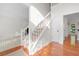 Bright foyer highlighting the staircase, light-filled space, and hardwood flooring at 1801 Summerview Ct, Woodstock, GA 30189