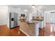 Charming kitchen features granite countertops, stainless steel appliances, and hardwood floors at 1801 Summerview Ct, Woodstock, GA 30189