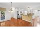 Open concept kitchen with granite island, stainless appliances, hardwood floors, and an eat-in breakfast area at 1801 Summerview Ct, Woodstock, GA 30189