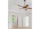 Spacious main bedroom with a ceiling fan, tray ceiling and doors to other rooms at 1801 Summerview Ct, Woodstock, GA 30189