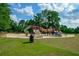 Community playground with slides and climbing structures in a grassy area at 1801 Summerview Ct, Woodstock, GA 30189