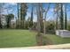 Large grassy backyard with a storage shed and fence providing a private outdoor space for recreation and storage at 3414 Dearwood Sw Dr, Lilburn, GA 30047