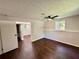 Basement area with wood flooring, natural light, and access to other rooms at 3414 Dearwood Sw Dr, Lilburn, GA 30047