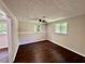 Basement with two windows for natural light and wood-look flooring throughout at 3414 Dearwood Sw Dr, Lilburn, GA 30047