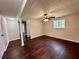 Basement living area with wood flooring, a window, and access to other rooms at 3414 Dearwood Sw Dr, Lilburn, GA 30047