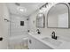 Beautifully remodeled bathroom features double sink vanity, new fixtures, and subway tile shower at 3414 Dearwood Sw Dr, Lilburn, GA 30047