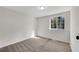 Bedroom featuring plush carpeting and a window offering natural light at 3414 Dearwood Sw Dr, Lilburn, GA 30047
