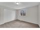 Bedroom with plush carpeting, neutral paint, and closet storage at 3414 Dearwood Sw Dr, Lilburn, GA 30047
