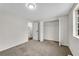 Bedroom with plush carpeting, neutral paint, and closet storage at 3414 Dearwood Sw Dr, Lilburn, GA 30047