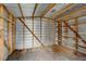 Shed interior with wooden frame and shelving, offering ample storage for tools and equipment at 3414 Dearwood Sw Dr, Lilburn, GA 30047