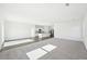 Bright, open living space featuring a kitchen, living room and carpeted Gathering area at 41 Bandimere Parkway, Dallas, GA 30157