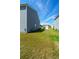 View of the backyard with ample space between homes and an establishing lawn in a Gathering-friendly neighborhood at 4420 Merrigold Way, Fairburn, GA 30213