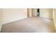 A spacious bedroom featuring neutral-colored walls and carpet at 4420 Merrigold Way, Fairburn, GA 30213