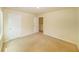 Bedroom featuring plush beige carpet and walls painted in soft eggshell color at 4420 Merrigold Way, Fairburn, GA 30213