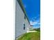 Side view of the home showing the concrete patio in the backyard at 4420 Merrigold Way, Fairburn, GA 30213