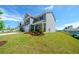 Two-story home featuring a well-manicured front lawn and landscaping at 4420 Merrigold Way, Fairburn, GA 30213