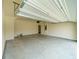 Large garage with automatic door opener, ample space for vehicles and storage at 4420 Merrigold Way, Fairburn, GA 30213