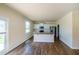 An open kitchen with stainless steel appliances and an island sink, and hardwood flooring, offering great space at 4420 Merrigold Way, Fairburn, GA 30213