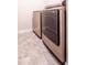Modern laundry room featuring a sleek washer and dryer set with stylish gray tile flooring at 4420 Merrigold Way, Fairburn, GA 30213