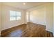 Bright living room featuring wood-look floors, neutral paint, and a bright, airy feel from ample lighting at 4420 Merrigold Way, Fairburn, GA 30213