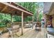 Spacious back deck with a wooded view, offering a great space for outdoor entertaining at 850 John Alden Rd, Stone Mountain, GA 30083