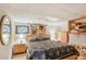 Cozy basement bedroom with a comfortable bed, soft lighting, and plenty of storage at 850 John Alden Rd, Stone Mountain, GA 30083