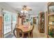Casual dining area with access to the backyard, with plenty of light and a view to the kitchen at 850 John Alden Rd, Stone Mountain, GA 30083