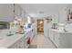 Functional kitchen with white appliances, lots of storage, and access to the formal dining room at 850 John Alden Rd, Stone Mountain, GA 30083