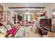 Spacious living room with exposed beams, comfortable seating, and a large television at 850 John Alden Rd, Stone Mountain, GA 30083
