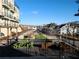 Balcony view showcases neighborhood amenities and charming streetscape at 962 Bibbs Circle Nw # 6, Atlanta, GA 30318