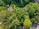 Aerial shot of the property nestled within a canopy of lush, mature trees at 1071 Standard Ne Dr, Brookhaven, GA 30319