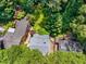 Aerial view of the property, showcasing the house and surrounding lush green landscape at 1071 Standard Ne Dr, Brookhaven, GA 30319