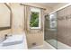 Modern bathroom with tile surround shower, and stone sink and vanity with sleek fixtures at 1071 Standard Ne Dr, Brookhaven, GA 30319