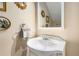 Vintage style bathroom featuring a decorative sink and mirror with unique gold sunburst accents at 1071 Standard Ne Dr, Brookhaven, GA 30319