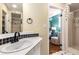 Bathroom with decorative tile backsplash, faucet detail, shower, and view to bedroom at 1071 Standard Ne Dr, Brookhaven, GA 30319