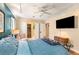 Bright bedroom with a TV, a closet, and a connecting door at 1071 Standard Ne Dr, Brookhaven, GA 30319