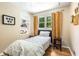 Comfortable bedroom features a window, a book shelf and hardwood floors at 1071 Standard Ne Dr, Brookhaven, GA 30319