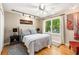 Bedroom featuring hardwood floors, natural light, custom décor, and light neutral paint at 1071 Standard Ne Dr, Brookhaven, GA 30319